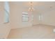 Bright living area featuring tile floors and large windows, perfect for entertaining at 790 Sunny Sagebrush St, Henderson, NV 89011