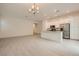 Open-concept living space with tile flooring, stainless steel appliances, and ample natural light at 790 Sunny Sagebrush St, Henderson, NV 89011
