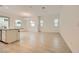Spacious, well-lit living room with neutral tile flooring and large windows offering ample natural light at 790 Sunny Sagebrush St, Henderson, NV 89011