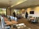 Spacious meeting room with tables, chairs, large windows, and decor to inspire a productive gathering at 790 Sunny Sagebrush St, Henderson, NV 89011