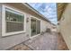 Cozy patio area with brick pavers and an outdoor lighting fixture at 790 Sunny Sagebrush St, Henderson, NV 89011