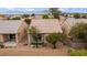 An aerial view shows the home and backyard with desert landscaping at 7934 Kiskadee St, North Las Vegas, NV 89084