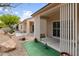 Backyard showing dual covered patios and low maintenance desert landscaping at 7934 Kiskadee St, North Las Vegas, NV 89084