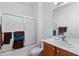 Bathroom with shower featuring glass doors and vanity at 7934 Kiskadee St, North Las Vegas, NV 89084