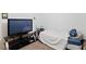 Bedroom with TV, bed, and neutral carpet at 7934 Kiskadee St, North Las Vegas, NV 89084