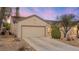 Charming single-story home featuring a neutral color palette, low-maintenance landscaping, and a two-car garage at 7934 Kiskadee St, North Las Vegas, NV 89084
