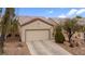 Inviting single-story home with desert landscaping and attached two car garage at 7934 Kiskadee St, North Las Vegas, NV 89084