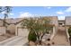 Charming single-story home featuring an inviting front porch, desert landscaping and attached two car garage at 7934 Kiskadee St, North Las Vegas, NV 89084