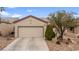 Inviting single-story home with low maintenance desert landscaping and attached two car garage at 7934 Kiskadee St, North Las Vegas, NV 89084