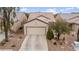 Inviting single-story home with desert landscaping and attached two car garage at 7934 Kiskadee St, North Las Vegas, NV 89084