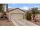 Inviting single-story home with desert landscaping and attached two car garage at 7934 Kiskadee St, North Las Vegas, NV 89084