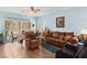 Cozy living room with comfortable seating, tile flooring, and natural light at 7934 Kiskadee St, North Las Vegas, NV 89084