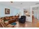 Inviting living room featuring tile floors, comfortable seating, and serene blue walls at 7934 Kiskadee St, North Las Vegas, NV 89084