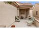 Charming covered patio with comfortable seating, perfect for relaxing outdoors at 7934 Kiskadee St, North Las Vegas, NV 89084