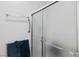 Shower featuring glass doors and a towel rack at 7934 Kiskadee St, North Las Vegas, NV 89084