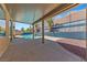 Covered back patio with a view of the pool and decorative privacy wall at 8029 Chablis Bay St, Las Vegas, NV 89131