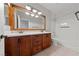 Bathroom featuring double vanity, white countertops, tile floor, and shower-tub combo at 8029 Chablis Bay St, Las Vegas, NV 89131