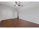Well-lit bedroom boasts wood floors, a ceiling fan and a closet at 8029 Chablis Bay St, Las Vegas, NV 89131