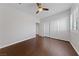 Comfortable bedroom showcasing wood flooring, a ceiling fan, and closet at 8029 Chablis Bay St, Las Vegas, NV 89131