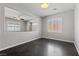 This bonus room includes a ceiling fan, two windows with shutters, and an opening to the staircase at 8029 Chablis Bay St, Las Vegas, NV 89131