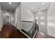 Upstairs hallway with wood floors and railing at 8029 Chablis Bay St, Las Vegas, NV 89131