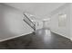 A brightly lit living room featuring a modern staircase and decorative alcove at 8029 Chablis Bay St, Las Vegas, NV 89131