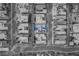Aerial view of a residential neighborhood featuring modern homes with pools, solar panels, and well-maintained landscapes at 819 Bolide St, Las Vegas, NV 89138