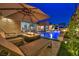 A lovely backyard features a pool, spa, lounge area and fire pit at 819 Bolide St, Las Vegas, NV 89138