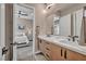 En-suite bathroom featuring double sinks, modern cabinets, and stylish finishes; adjacent bedroom with contemporary decor at 819 Bolide St, Las Vegas, NV 89138