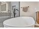 Bright bathroom features a modern soaking tub with matte black fixtures and glass enclosed shower with stylish tile surround at 819 Bolide St, Las Vegas, NV 89138