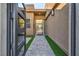 Inviting front entrance with a stylish walkway leading to the modern glass door at 819 Bolide St, Las Vegas, NV 89138