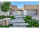 Contemporary home featuring a landscaped front yard and private entry at 819 Bolide St, Las Vegas, NV 89138