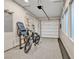 This garage has an epoxy floor, bike, and exercise equipment at 819 Bolide St, Las Vegas, NV 89138