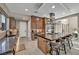 Well-equipped kitchen featuring a large island with seating and updated appliances at 819 Bolide St, Las Vegas, NV 89138