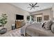 Serene main bedroom featuring a king-sized bed, a dresser, and a view of the backyard at 819 Bolide St, Las Vegas, NV 89138