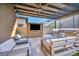 An outdoor patio with a built-in grill, outdoor TV, comfortable seating, and a pergola at 819 Bolide St, Las Vegas, NV 89138