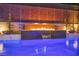 This luxurious pool has a water feature with an elegant patterned privacy fence at 819 Bolide St, Las Vegas, NV 89138
