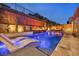Backyard with a modern pool, fire feature and lounge chairs at 819 Bolide St, Las Vegas, NV 89138