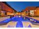 Inviting backyard pool with tanning ledge, lounge chairs, and fire feature, perfect for outdoor entertaining at 819 Bolide St, Las Vegas, NV 89138