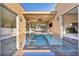 Stunning outdoor pool and patio with water feature merging indoor and outdoor living spaces at 819 Bolide St, Las Vegas, NV 89138