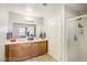 The main bathroom features dual sinks, a large vanity, and a full glass shower with an entrance to the main bedroom at 8255 Las Vegas Blvd # 713, Las Vegas, NV 89123