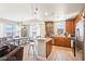 Bright kitchen showcasing wood cabinets, stainless steel appliances, a kitchen island, and a lovely view at 8255 Las Vegas Blvd # 713, Las Vegas, NV 89123