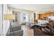 Spacious living room features contemporary decor, stainless steel appliances, and an open concept kitchen and dining area at 8255 Las Vegas Blvd # 713, Las Vegas, NV 89123