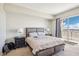 Bright bedroom features a comfortable bed, bedside tables, and sliding doors to a balcony with a view at 8255 Las Vegas Blvd # 713, Las Vegas, NV 89123