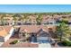 Aerial view of a well-maintained home with a tile roof and lush landscaping at 8901 Kingsmill Dr, Las Vegas, NV 89134