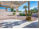 Private backyard featuring a pergola, desert landscaping, concrete patio and a block wall at 8901 Kingsmill Dr, Las Vegas, NV 89134