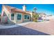 Private backyard with desert landscaping, patio, and a covered pergola, ideal for outdoor living at 8901 Kingsmill Dr, Las Vegas, NV 89134