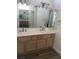 Bright bathroom with double sink vanity and large mirrors, perfect for a functional, modern space at 8901 Kingsmill Dr, Las Vegas, NV 89134