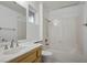Bathroom with a vanity sink, toilet, and shower-tub combo at 8901 Kingsmill Dr, Las Vegas, NV 89134