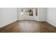 Bedroom showcasing wood floors and a bay window for natural light at 8901 Kingsmill Dr, Las Vegas, NV 89134